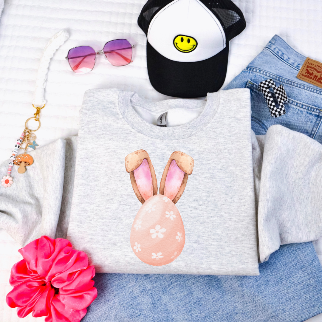 Customized youth grey crewneck watercolor peach egg with white flowers and bunny ears matching tees and hoodies available In adult and youth sizes 