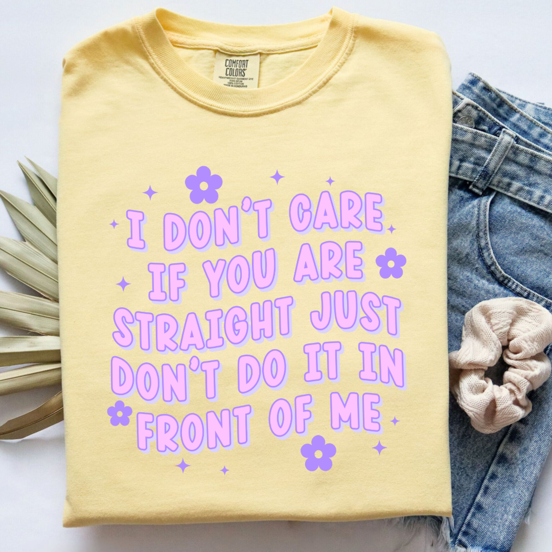 Customized Adult Comfort Colors Butter Yellow Graphic Tee Quoted " I don't care if you're straight just don't do it in front of me.  Purple bubble letters with flowers spread out Matching Adult Crewnecks available Perfect for Pride.