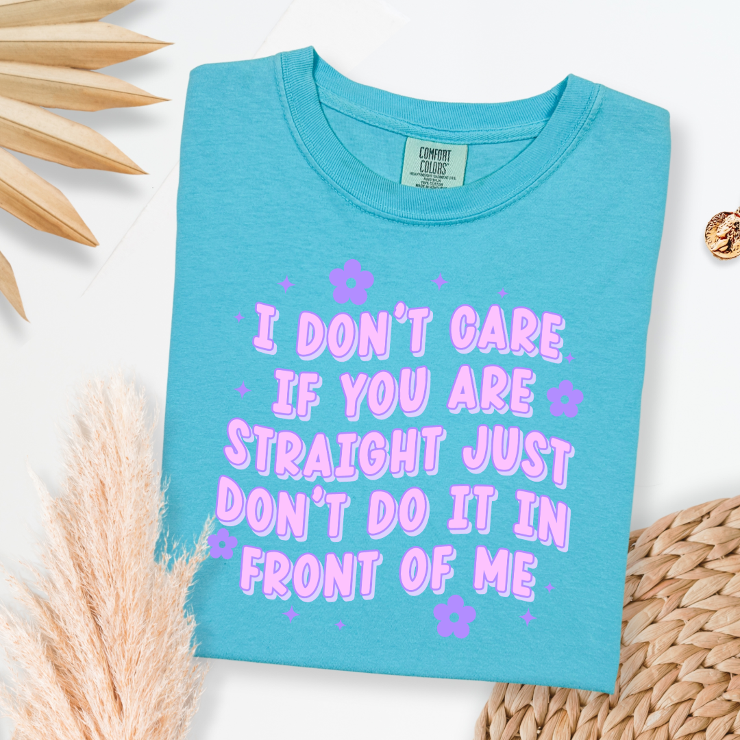 Customized Adult Comfort Colors Lagoon Blue Graphic Tee Quoted " I don't care if you're straight just don't do it in front of me.  Purple bubble letters with flowers spread out Matching Adult Crewnecks available Perfect for Pride.
