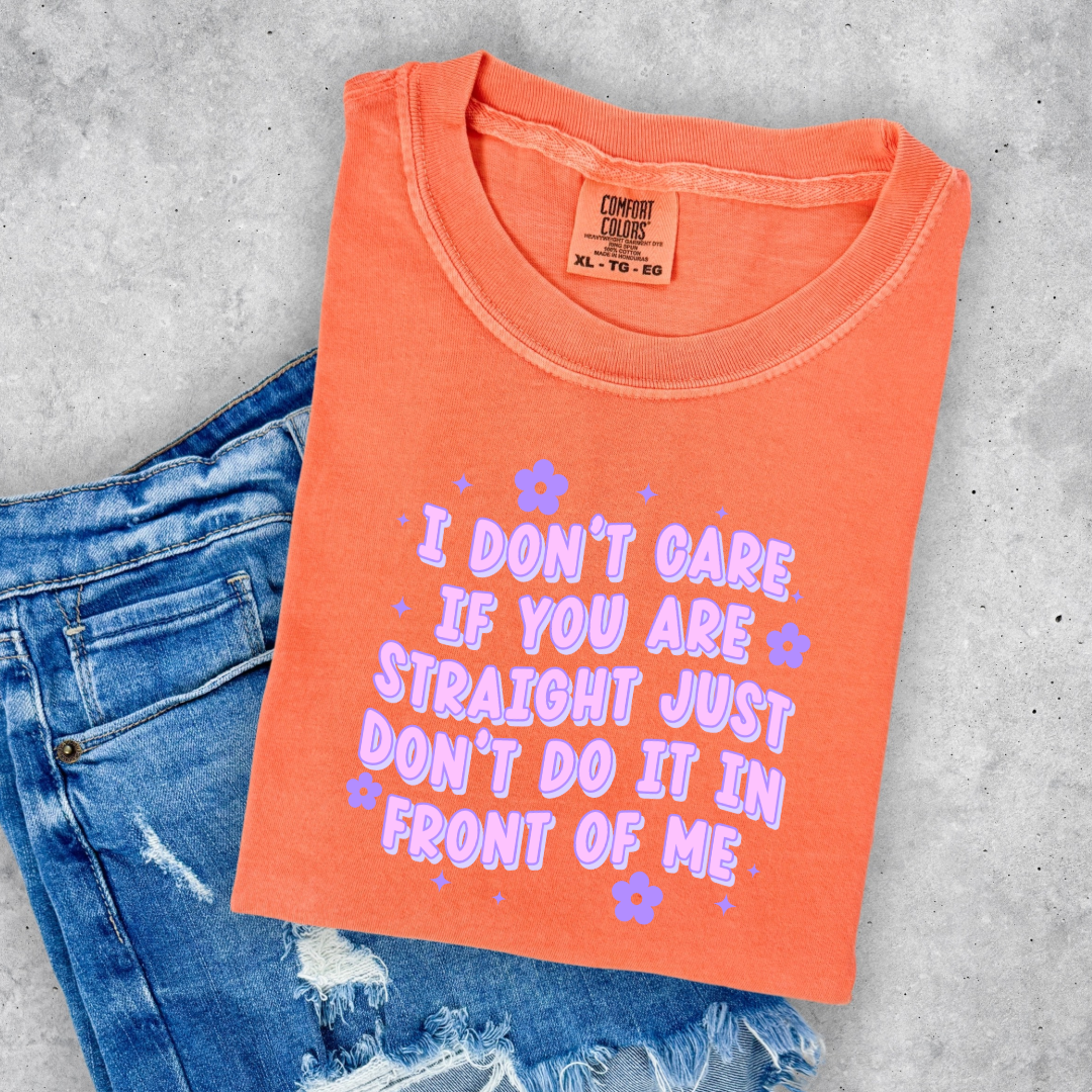Customized Adult Comfort Colors Melon orange Graphic Tee Quoted " I don't care if you're straight just don't do it in front of me.  Purple bubble letters with flowers spread out Matching Adult Crewnecks available Perfect for Pride.