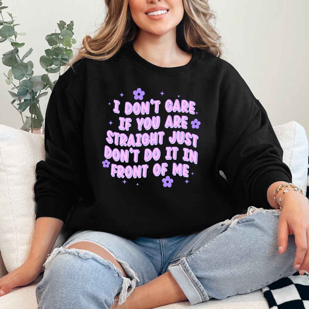 Customized Adult Comfort Colors black Graphic Tee Quoted " I don't care if you're straight just don't do it in front of me.  Purple bubble letters with flowers spread out Matching Adult graphic tees available Perfect for Pride.