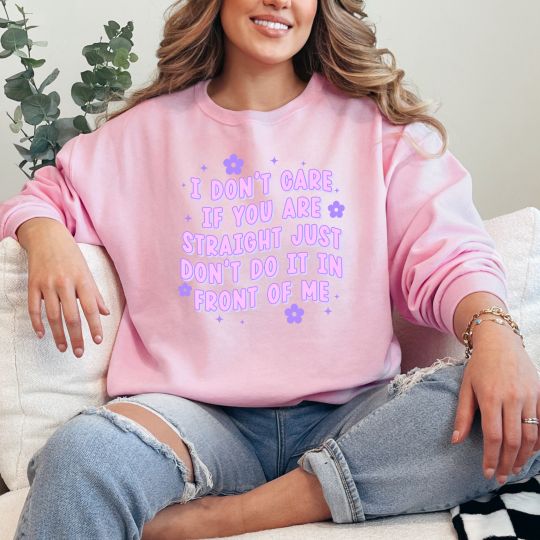 Customized Adult Comfort Colors light pink Graphic Tee Quoted " I don't care if you're straight just don't do it in front of me.  Purple bubble letters with flowers spread out Matching Adult graphic tees available Perfect for Pride.