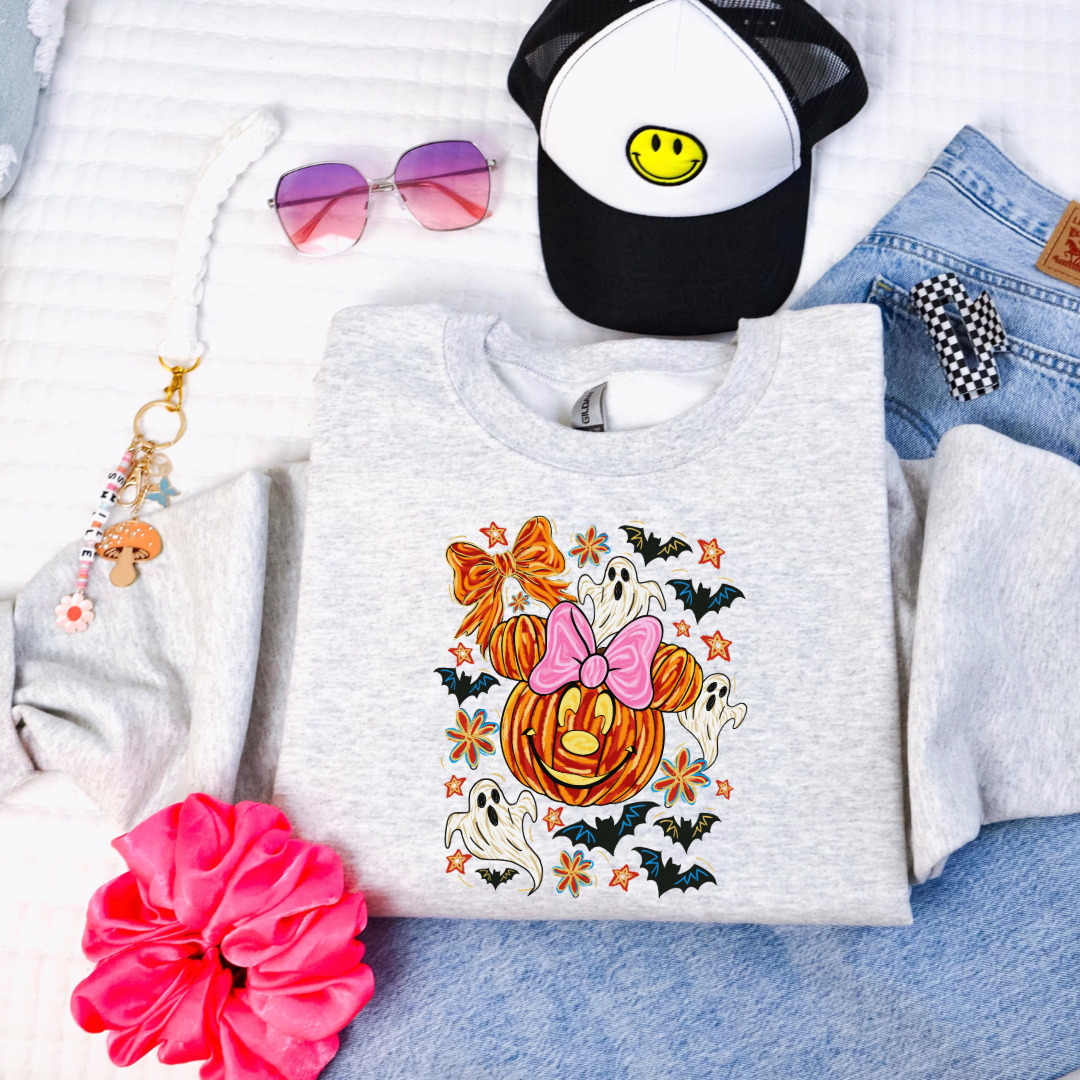 Youth Ash Grey Crewneck with Dimensional Minnie Mouse pumpkin head with ghosts, bows and bats. This Design Is available in Youth sizes Small through XL. Mickey Mouse available as well 