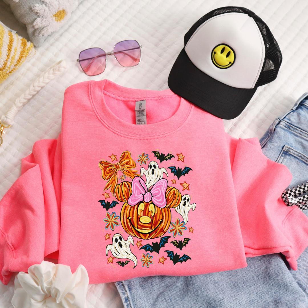 Youth Safety Pink Folded Flat Lay Crewneck with Dimensional Minnie Mouse pumpkin head with ghosts, bows and bats. This Design Is available in Youth sizes Small through XL. Mickey Mouse available as well 