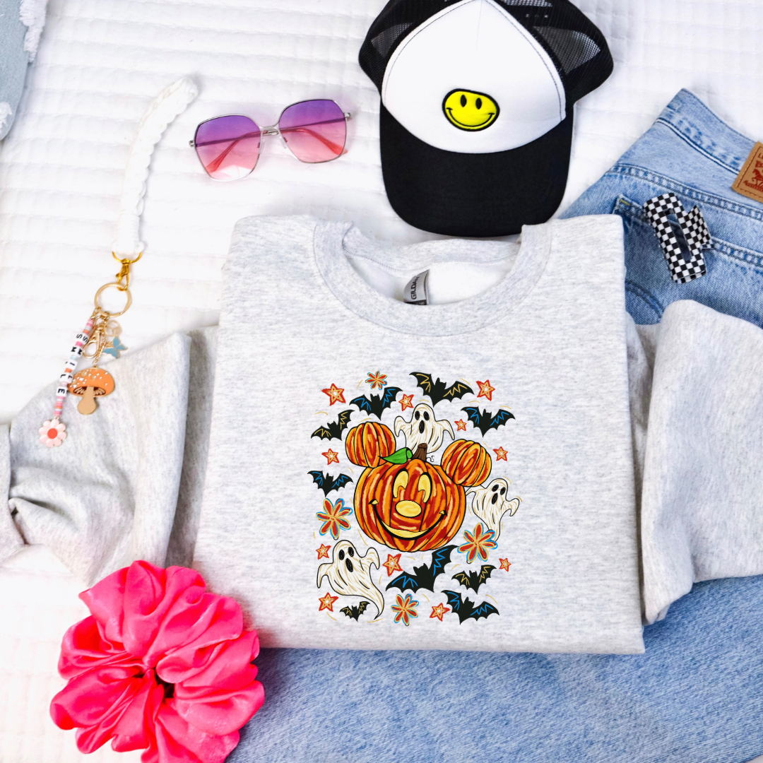 Youth Ash Grey Crewneck with Dimensional Mickey Mouse pumpkin head with ghosts, bows and bats. This Design Is available in Youth sizes Small through XL. Minnie Mouse available as well 