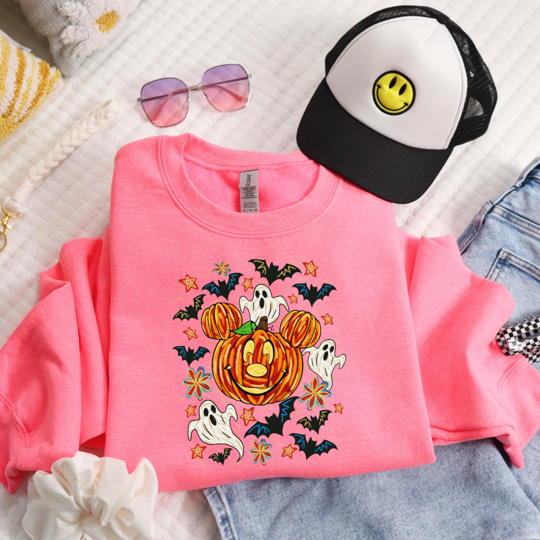 Youth Safety Pink Folded flat lay Crewneck with Dimensional Mickey Mouse pumpkin head with ghosts, bows and bats. This Design Is available in Youth sizes Small through XL. Minnie Mouse available as well 