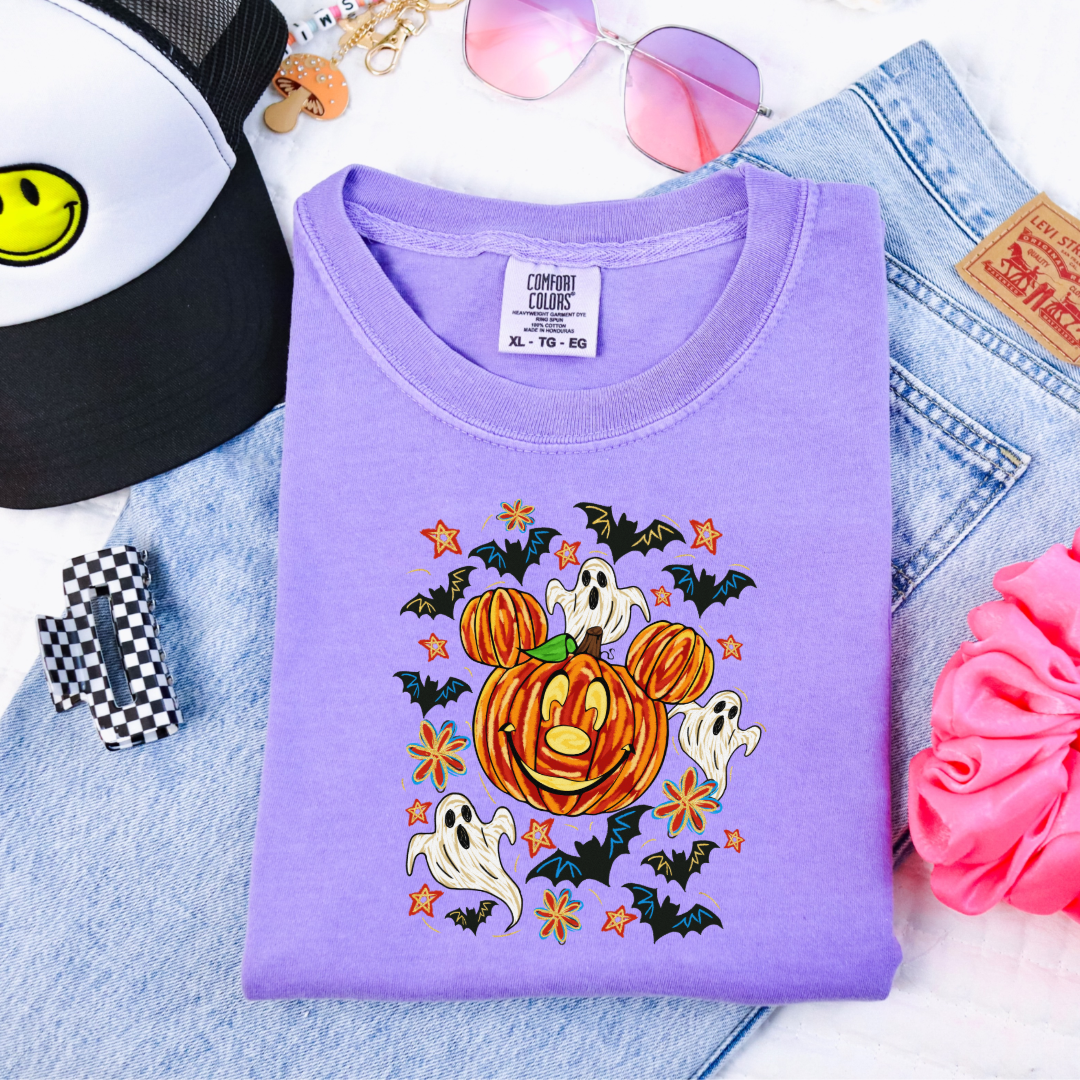 Youth Comfort Colors Violet Graphic Tee with Dimensional Mickey Mouse pumpkin head with ghosts, bows and bats. This Design Is available in Youth sizes Small through XL. Minnie Mouse available as well 