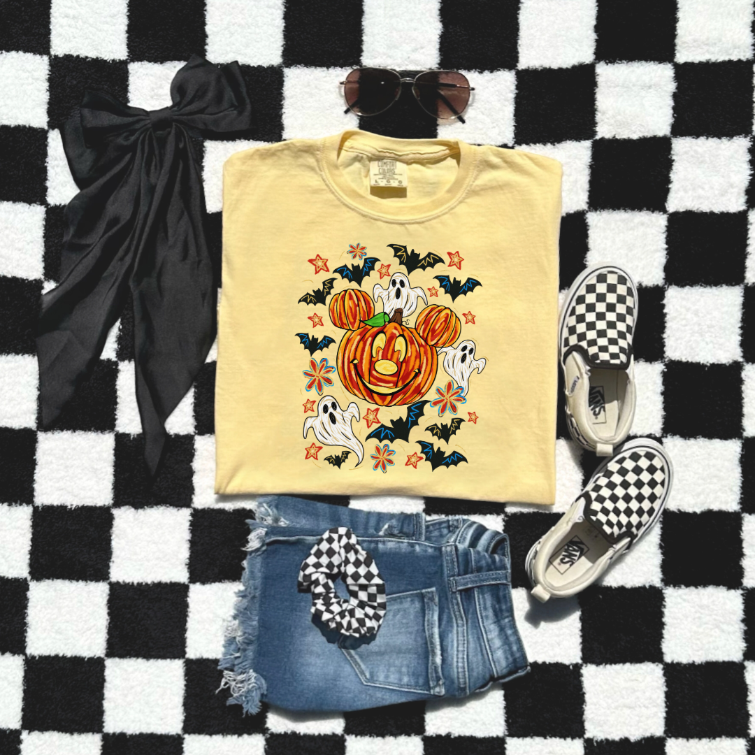Youth Comfort Colors Butter Yellow Graphic Tee with Dimensional Mickey Mouse pumpkin head with ghosts, bows and bats. This Design Is available in Youth sizes Small through XL. Minnie Mouse available as well 