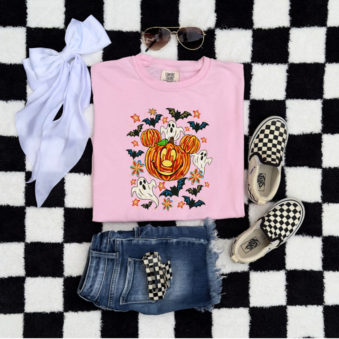 Youth Comfort Colors Blossom Pink Graphic Tee with Dimensional Mickey Mouse pumpkin head with ghosts, bows and bats. This Design Is available in Youth sizes Small through XL. Minnie Mouse available as well 