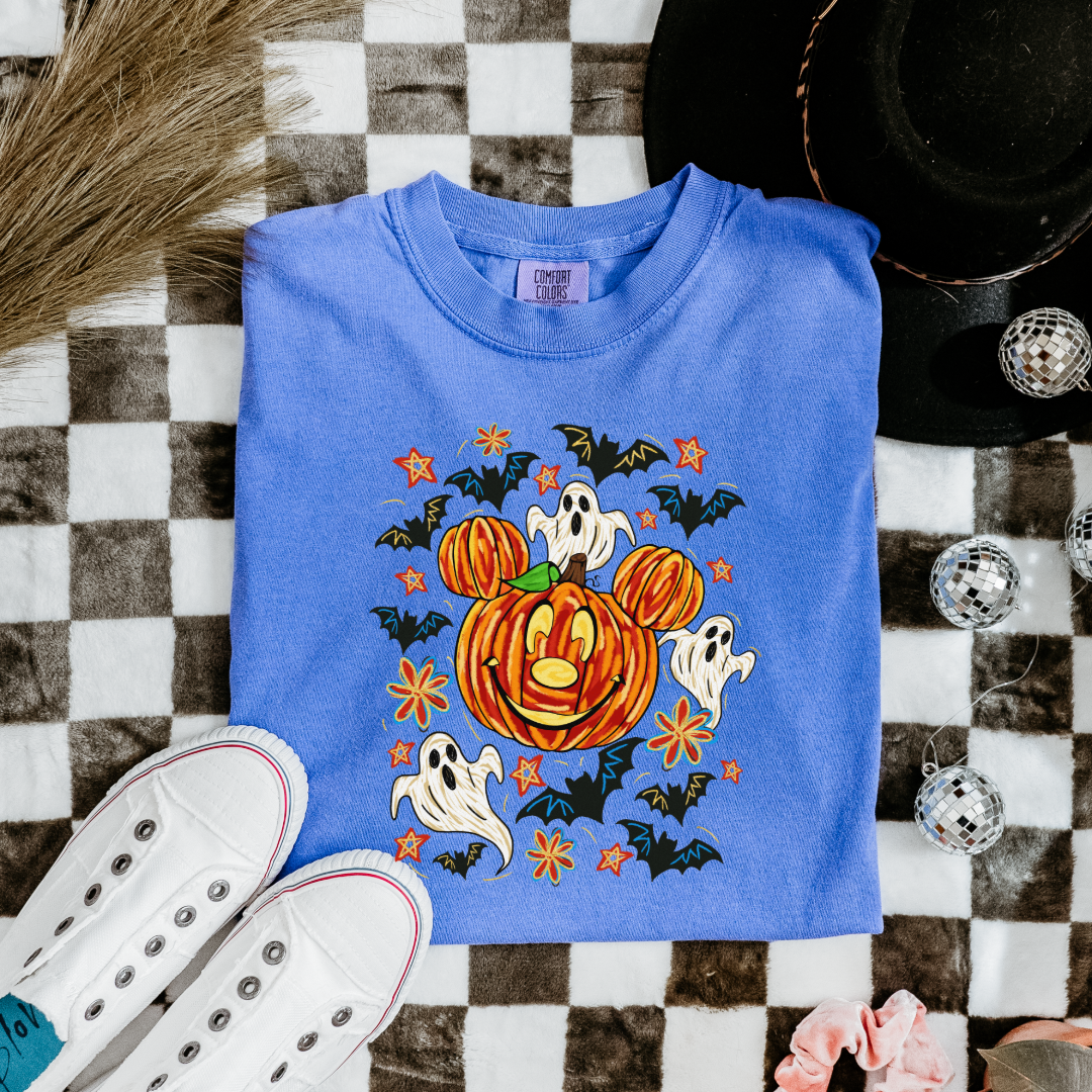 Youth Comfort Colors Flo Blue Graphic Tee with Dimensional Mickey Mouse pumpkin head with ghosts, bows and bats. This Design Is available in Youth sizes Small through XL. Minnie Mouse available as well 