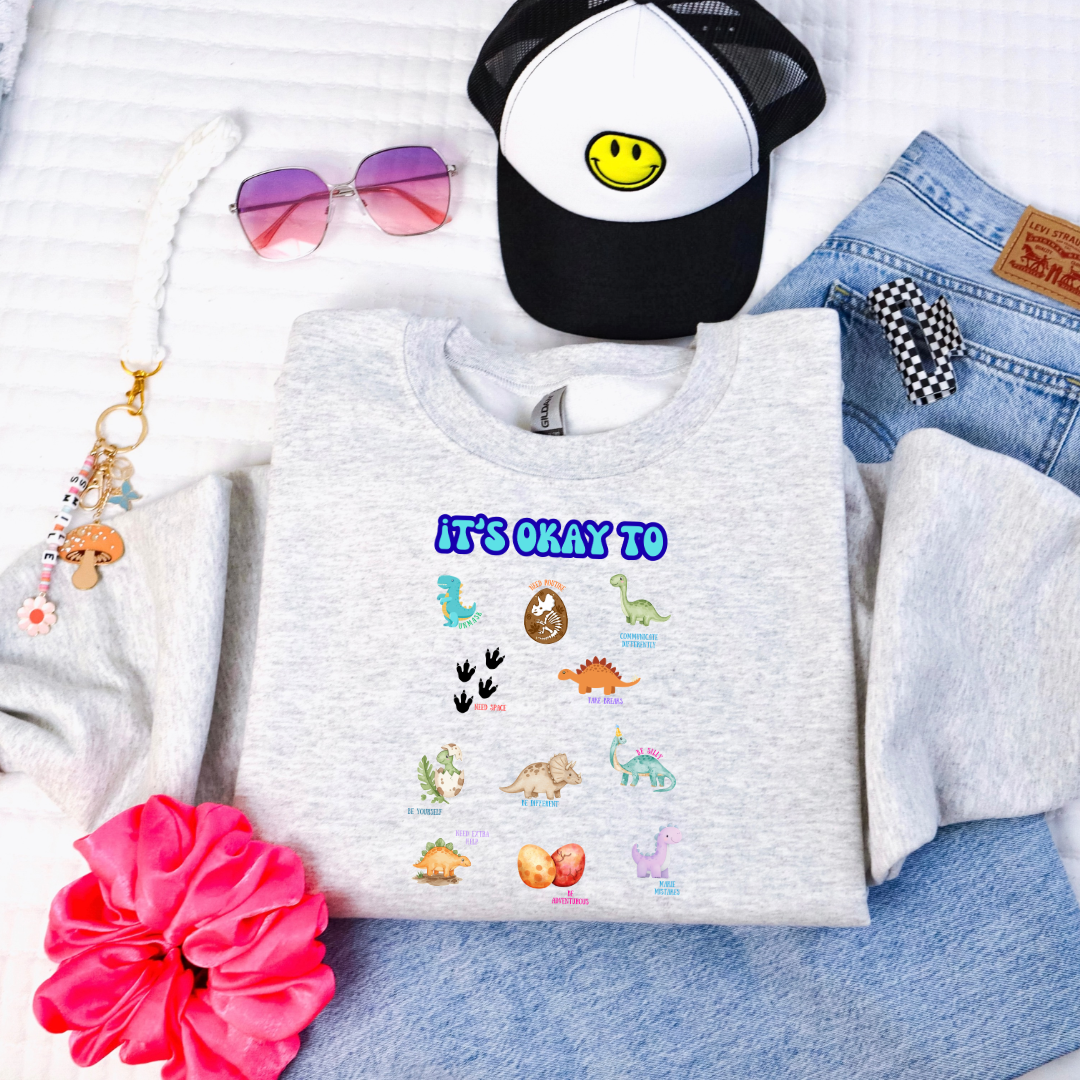It's Okay To Dinosaurs Youth Graphic Tee & Crewneck