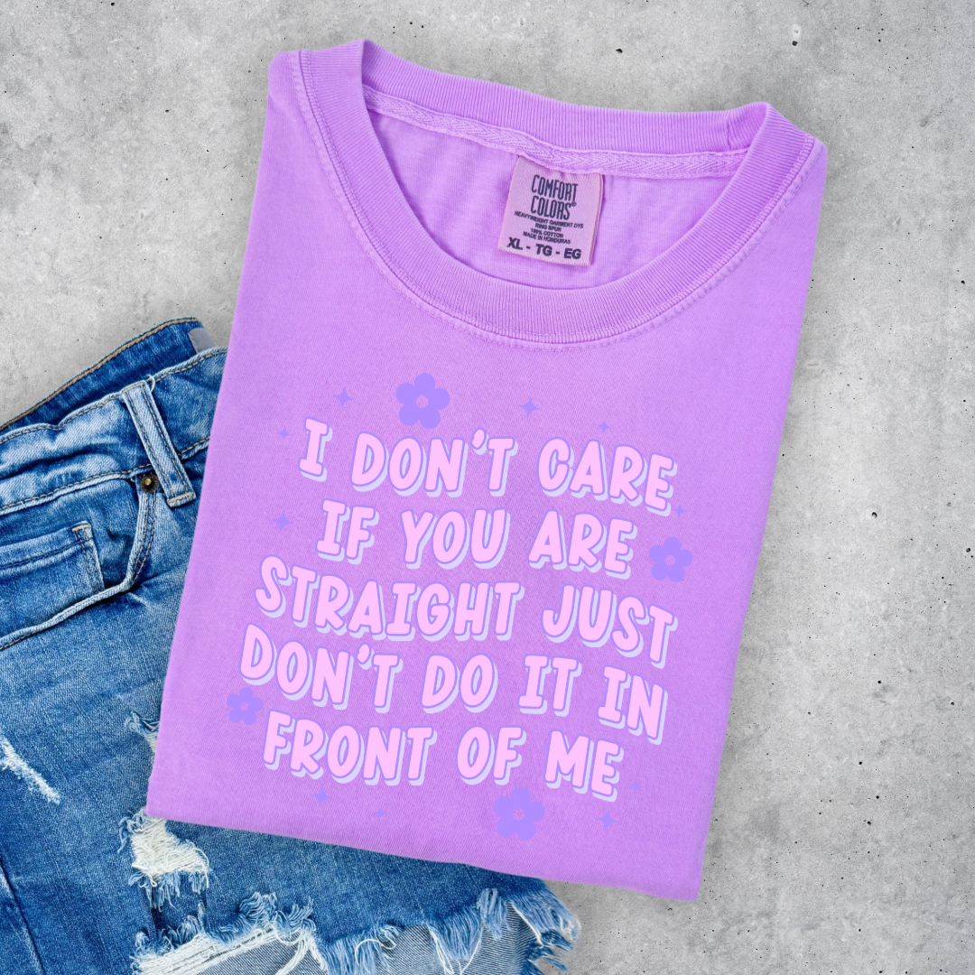 Customized Adult Comfort Colors Neon Violet  Graphic Tee Quoted " I don't care if you're straight just don't do it in front of me.  Purple bubble letters with flowers spread out Matching Adult Crewnecks available Perfect for Pride.