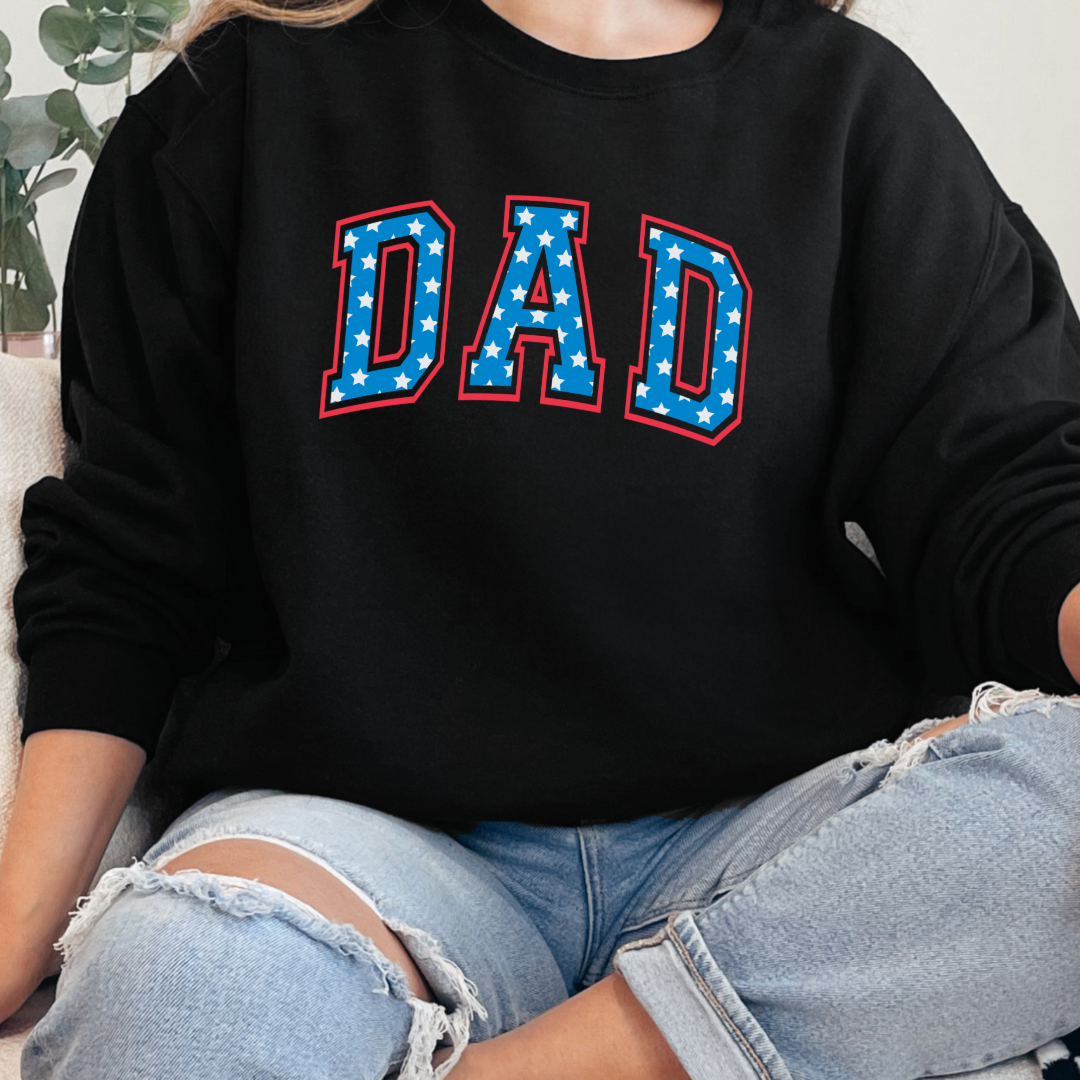 Customized adult Black Crewneck  with Seasonal 4th of July University style Font DAD blue with white stars outlined un red , This style is available in adult  Graphic Tees as well as adult crewnecks and hoodies .Available In DAD, MAMA and MINI. 