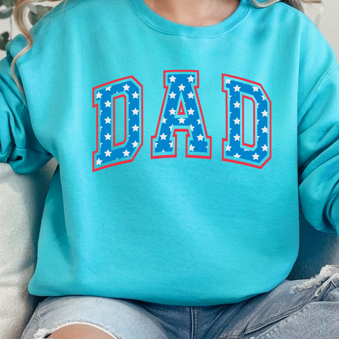 Customized adult Scuba Crewneck  with Seasonal 4th of July University style Font DAD blue with white stars outlined un red , This style is available in adult  Graphic Tees as well as adult crewnecks and hoodies .Available In DAD, MAMA and MINI. 