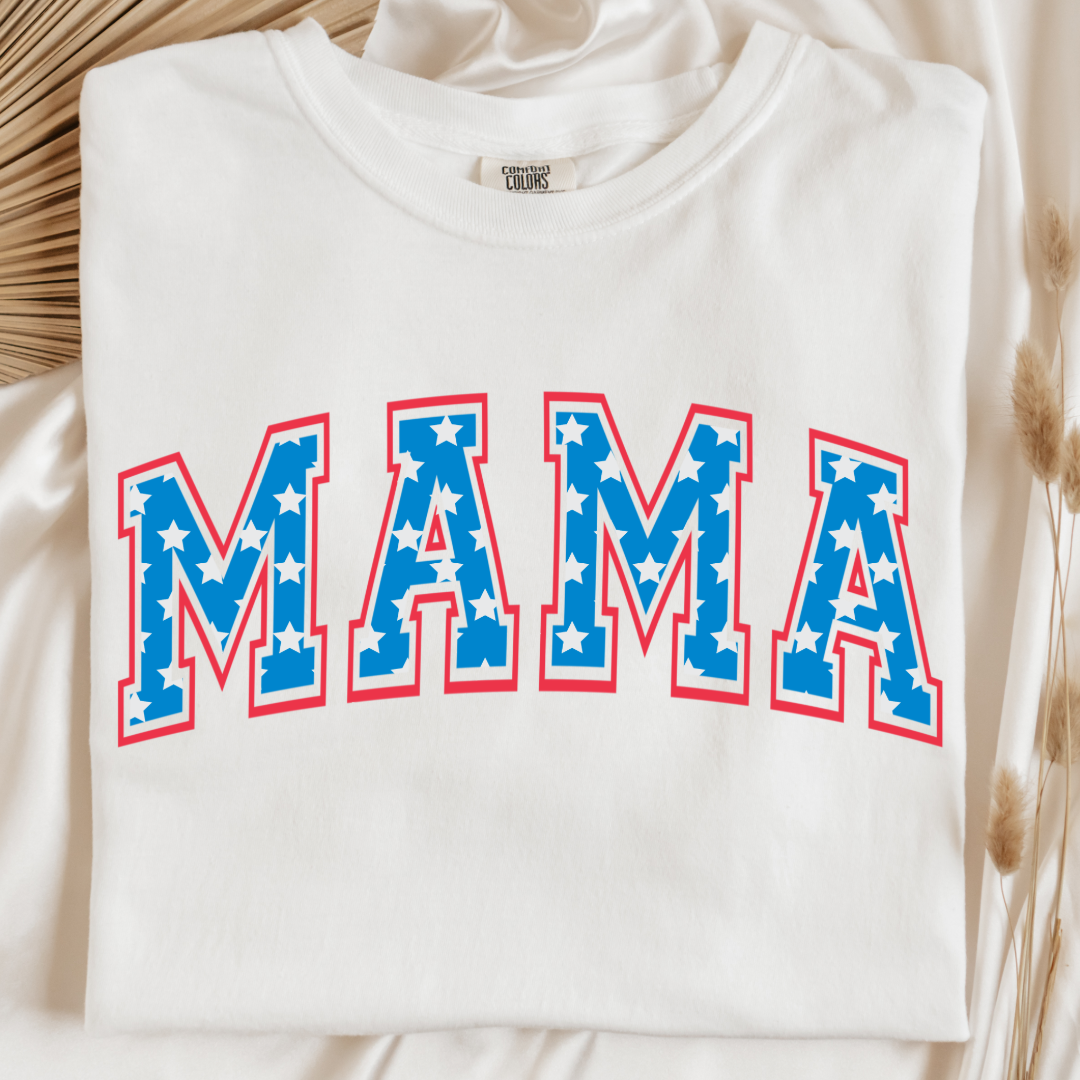 Customized adult Comfort Colors White Graphic Tee  with Seasonal 4th of July University style Font MAMA blue with white stars outlined un red , This style is available in adult  Graphic Tees as well as adult crewnecks and hoodies .Available In DAD, MAMA and MINI. 