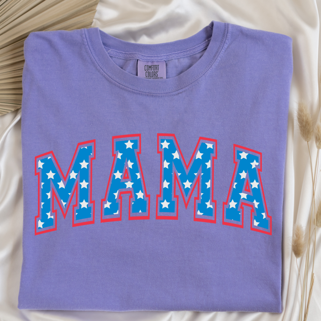 Customized adult Comfort Colors Violet Graphic Tee  with Seasonal 4th of July University style Font MAMA blue with white stars outlined un red , This style is available in adult  Graphic Tees as well as adult crewnecks and hoodies .Available In DAD, MAMA and MINI. 